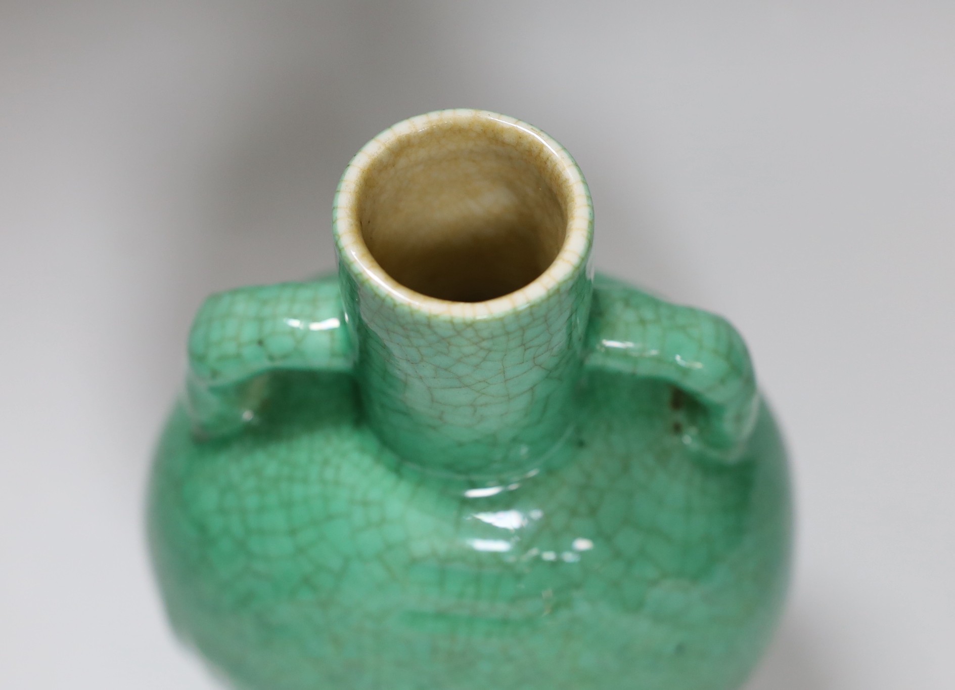 A 19th century Chinese green crackle glaze ‘eight trigrams’ moonflask, 19.5cm